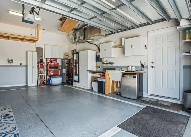 2 Car Garage w/built in cabinets