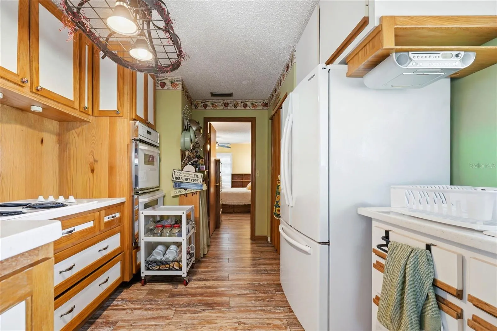Closet laundry on R, hall leads to primary bedroom