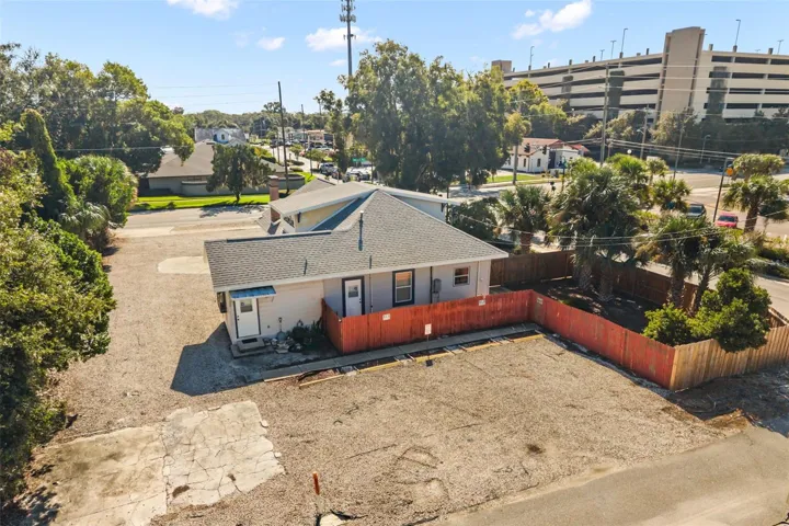Rear office entrance &amp; parking with fenced area surrounding private residential entrance &amp; 2nd floor access
