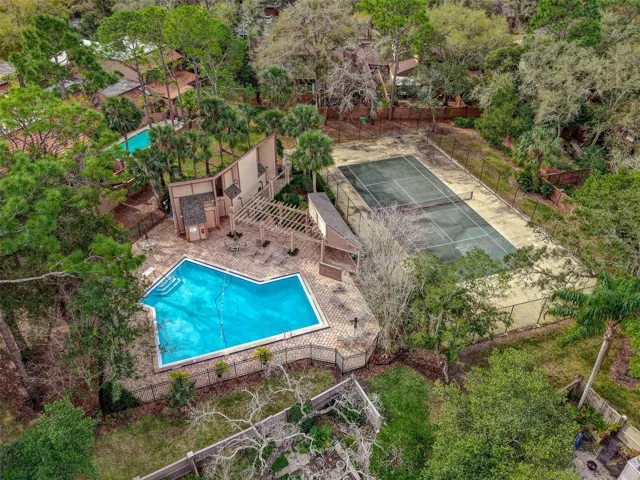 Community pool and clay tennis courts for Whispering Pines village