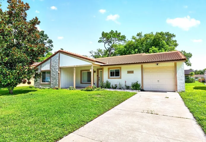 This beautifully renovated 3-bedroom, 2-bath floor plan in the Lime Tree community offers a fresh, modern interior plus a spacious COVERED FRONT PORCH, FLORIDA ROOM and 1-car garage!