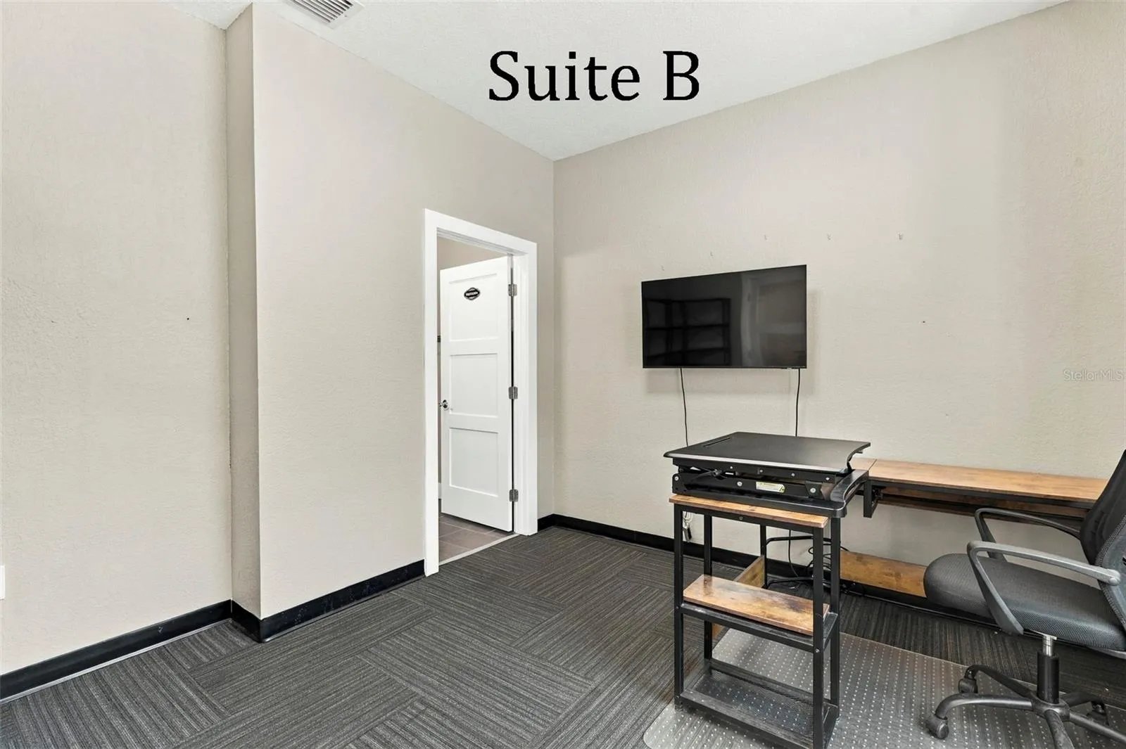Double Glass Doors into Suite B, with Private Full Bathroom, Window to the Front of the Office, located by the Lobby