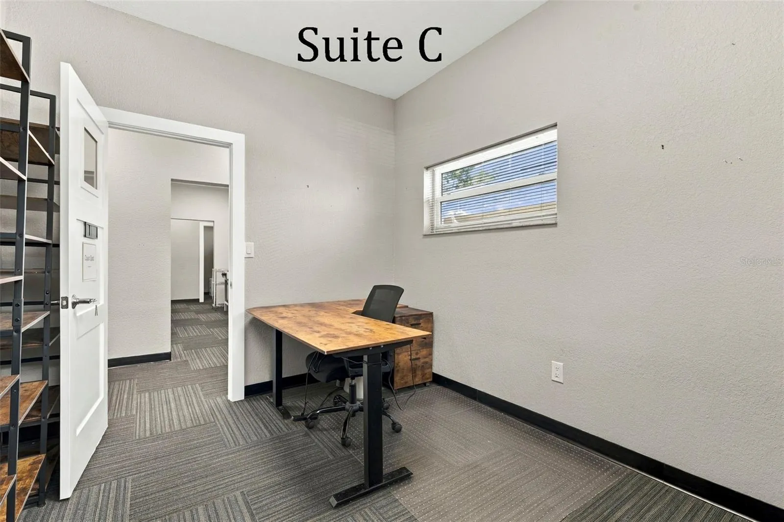 Suite C has 2 high windows and is located by the Coffee Station, Hall Restroom and Covered Patio Break Common Area