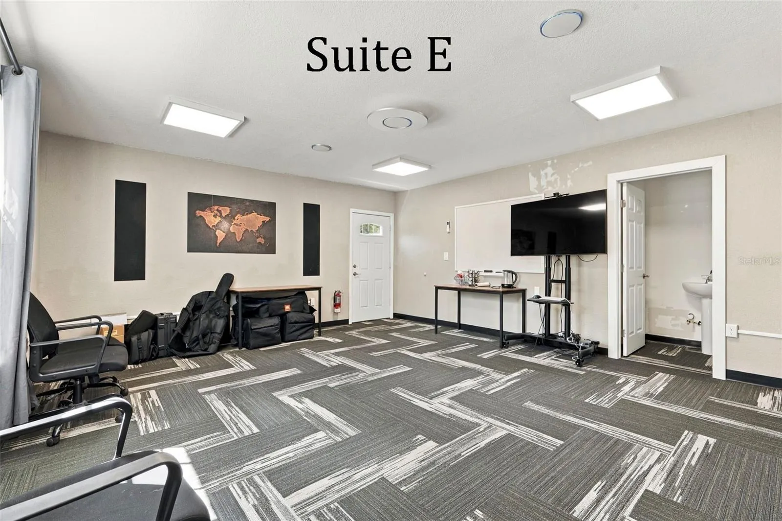 Suite E has a private entrance, large window overlooking the landscaping, a private restroom and has access to the Covered Patio Break Area