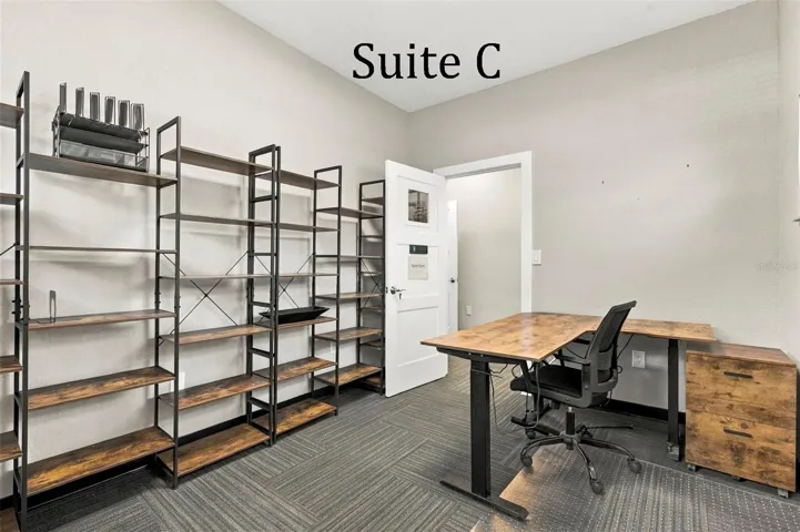 Suite C has 2 high windows and is located by the Coffee Station, Hall Restroom and Covered Patio Break Common Area