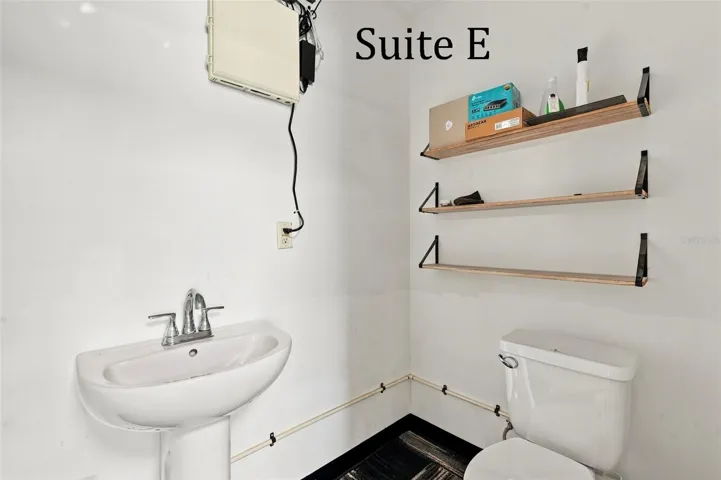 Suite E has a private entrance, large window overlooking the landscaping, a private restroom and has access to the Covered Patio Break Area