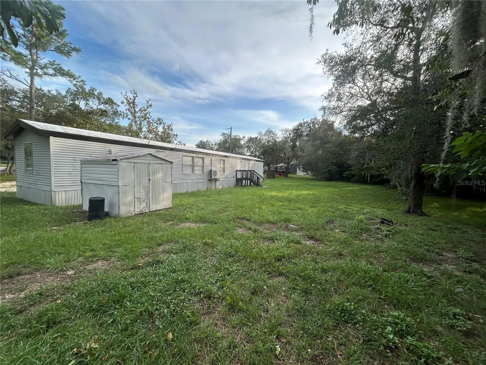 Back view with storage shed