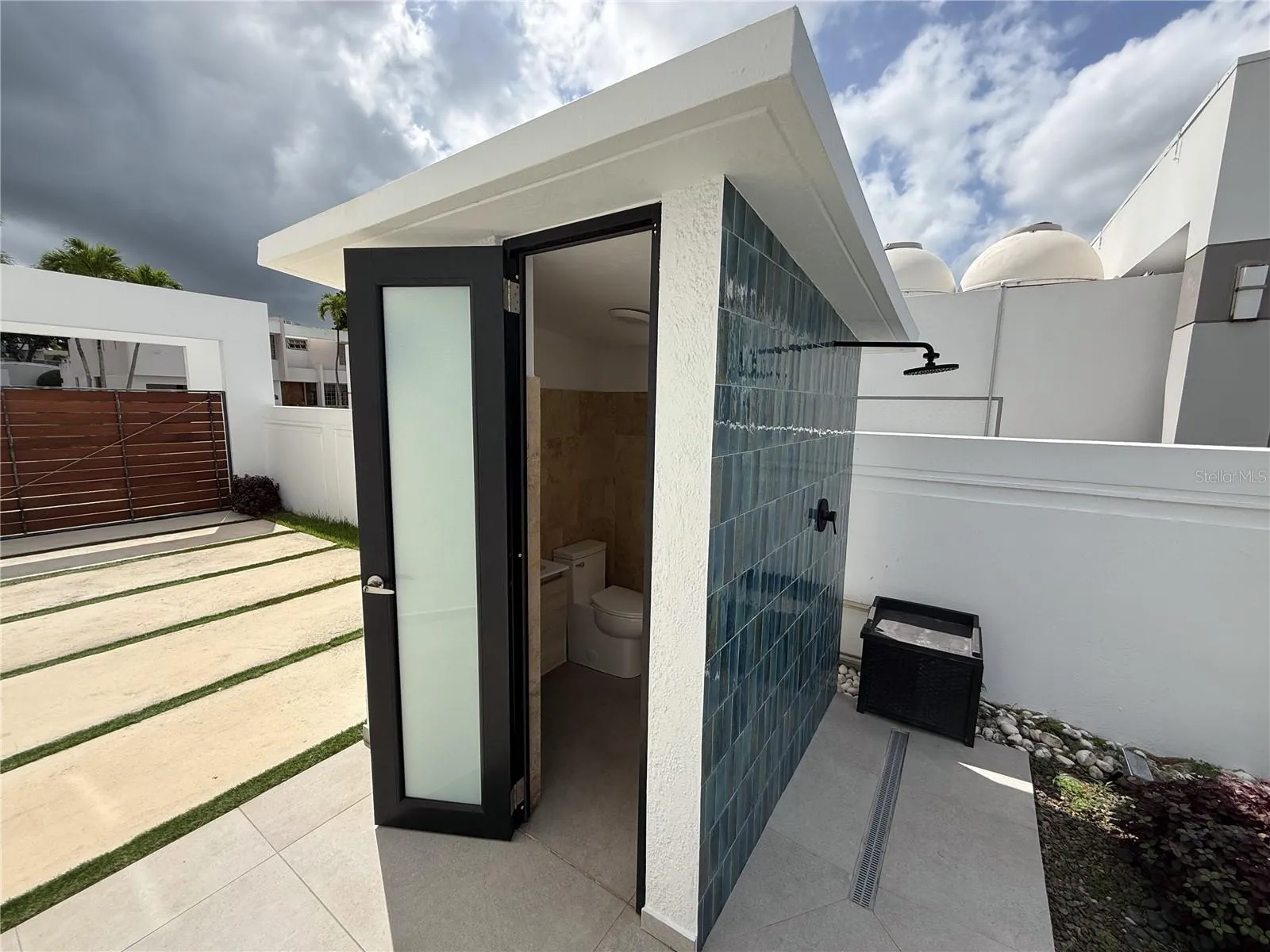 pool half bath with exterior shower