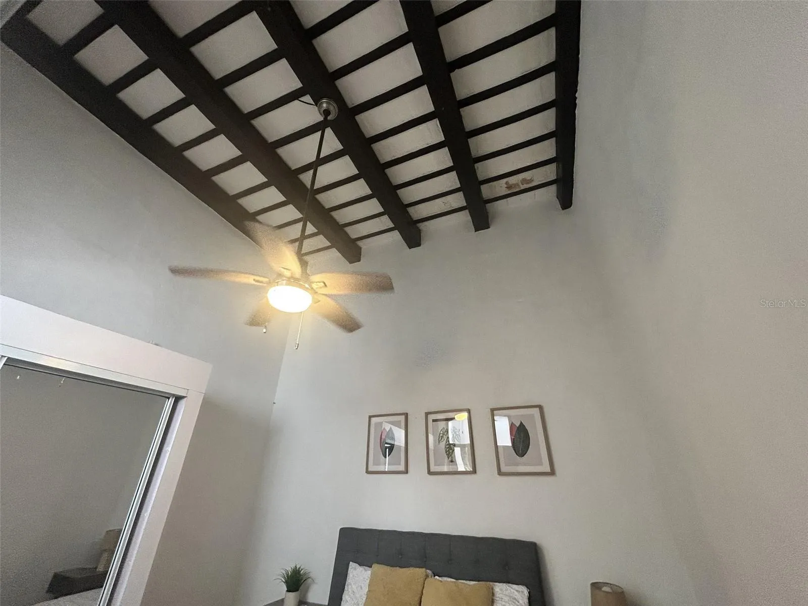 Second bedroom, wood-beam ceiling and ceiling fan Second bedroom, wood-beam ceiling and ceiling fan