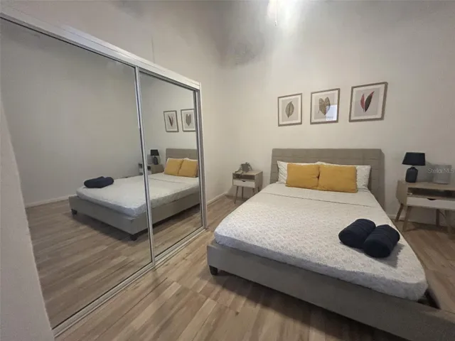 Bedroom with mirrored closet