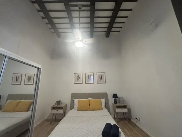 Bedroom, wood-beam ceiling and ceiling fan