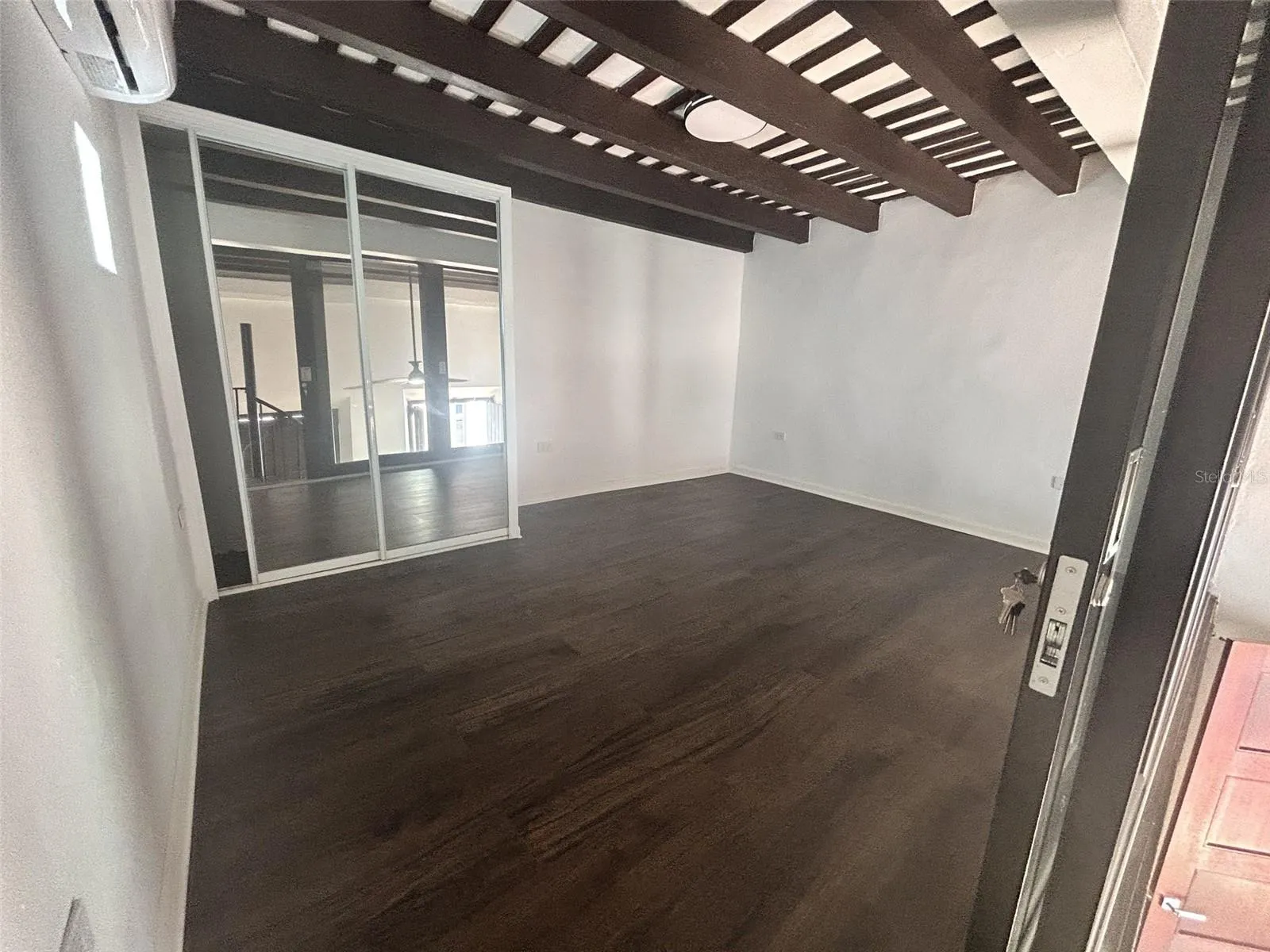 Master bedroom with glass doors and split A/C