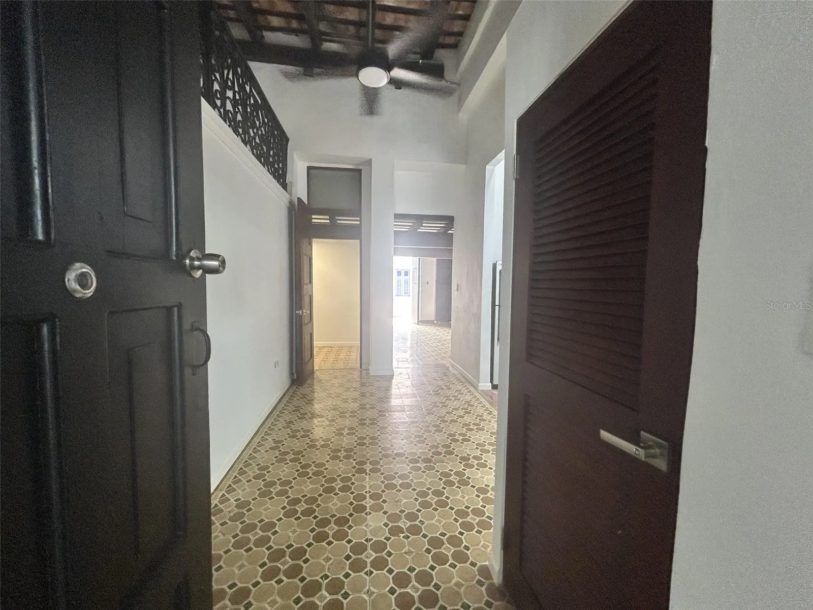 Entry: small hall to the utility room, bath and kitchen; living room at the end
