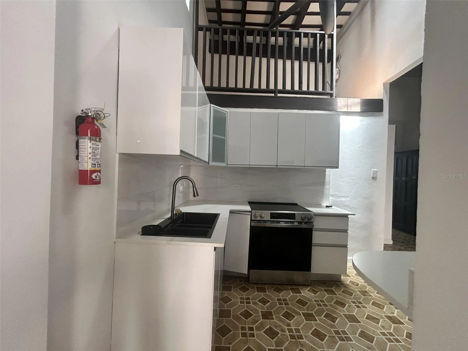 Remodeled kitchen with stove, open to the living room