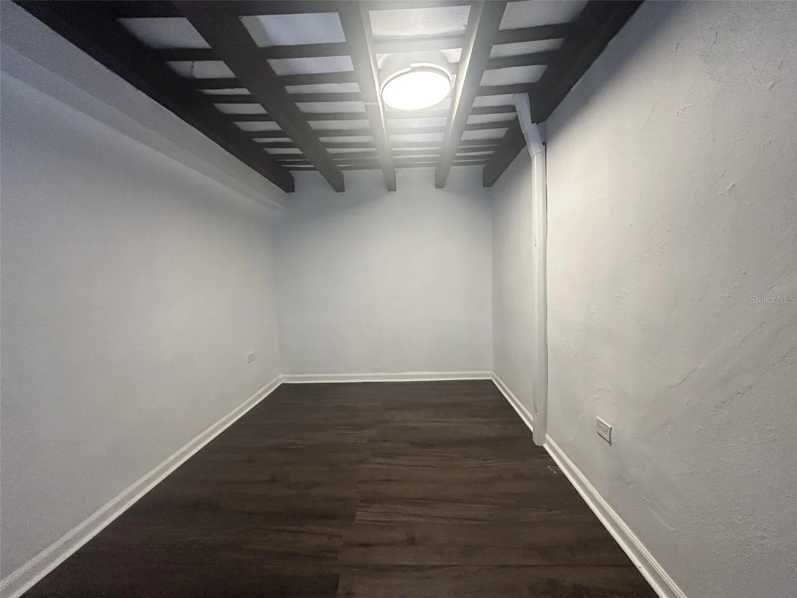 Bedroom 2, upper level, above bedroom 3, own spiral stairs, wood floor