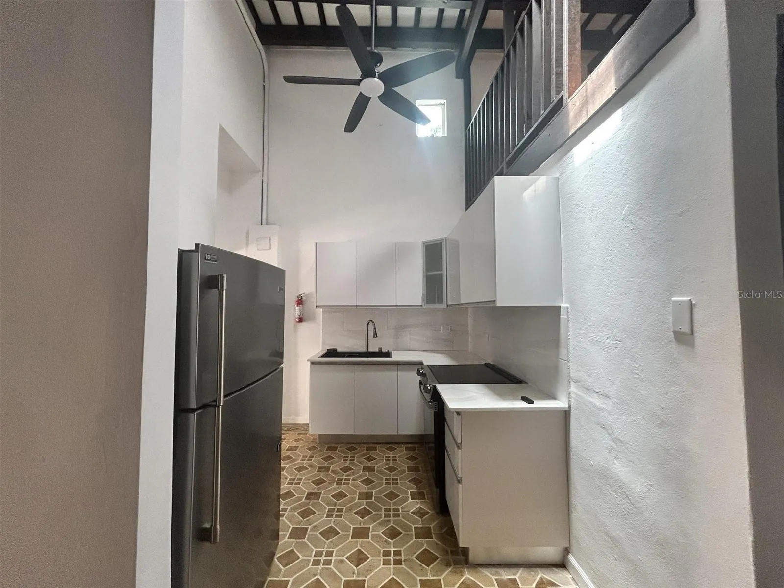Kitchen with refrigerator