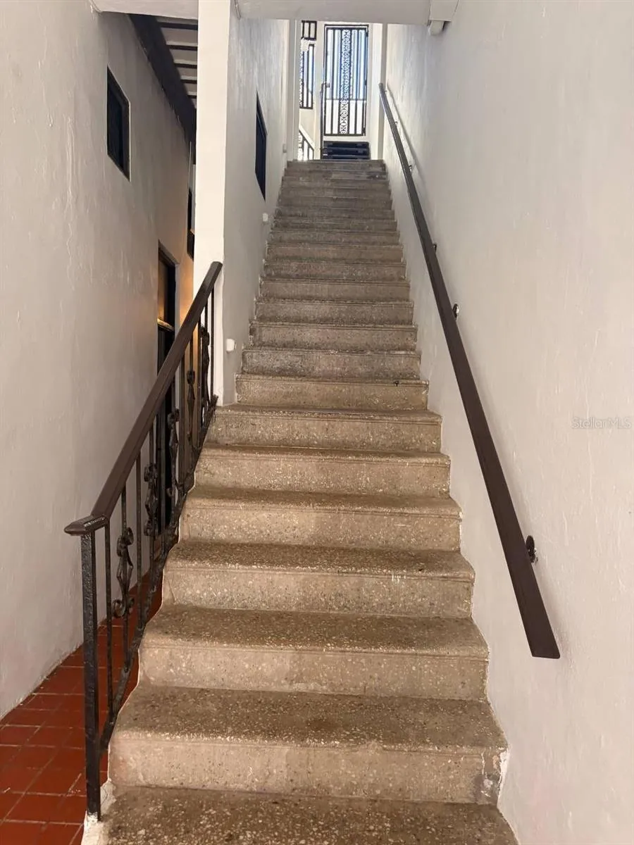 Staircase from the gated entrance to the second floor