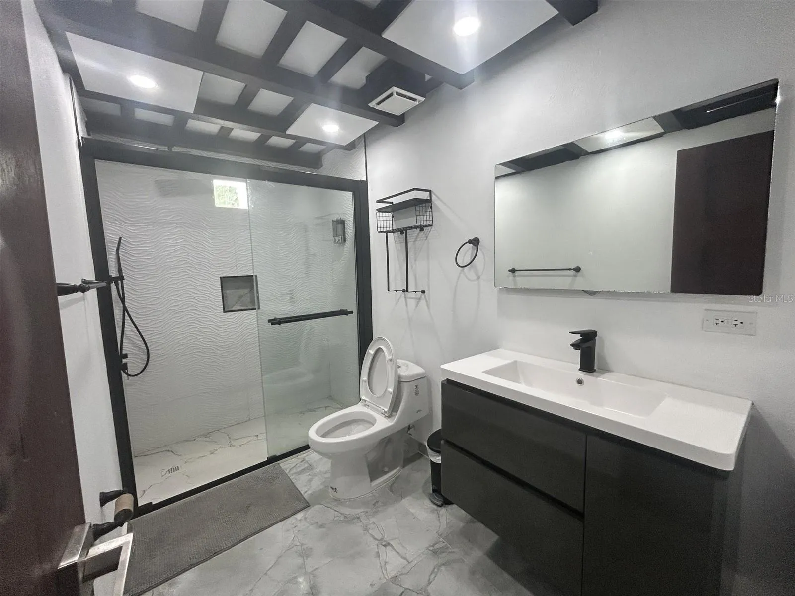 Remodeled bathroom with glass shower