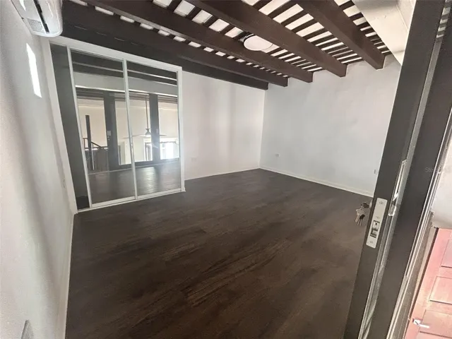 Master bedroom with glass doors and split A/C