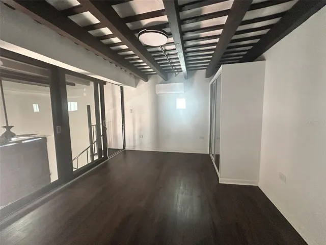 Master bedroom, glass doors, split A/C and wood floors