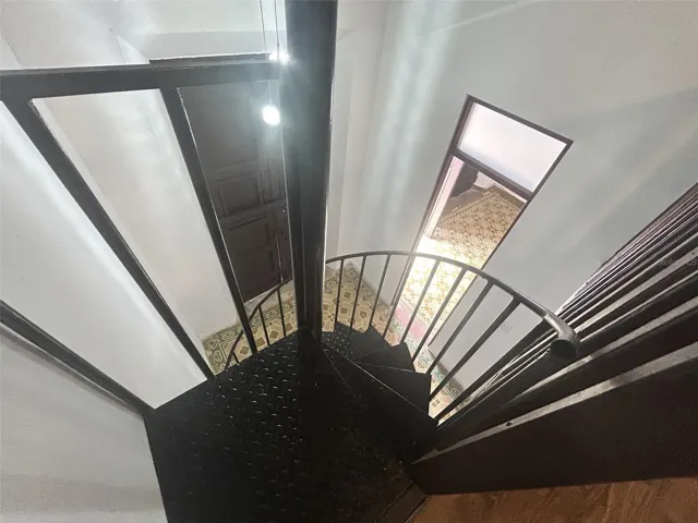 Spiral staircase up to bedroom 2