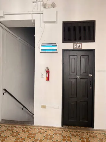 Unit 2A door, right beside the top of the staircase