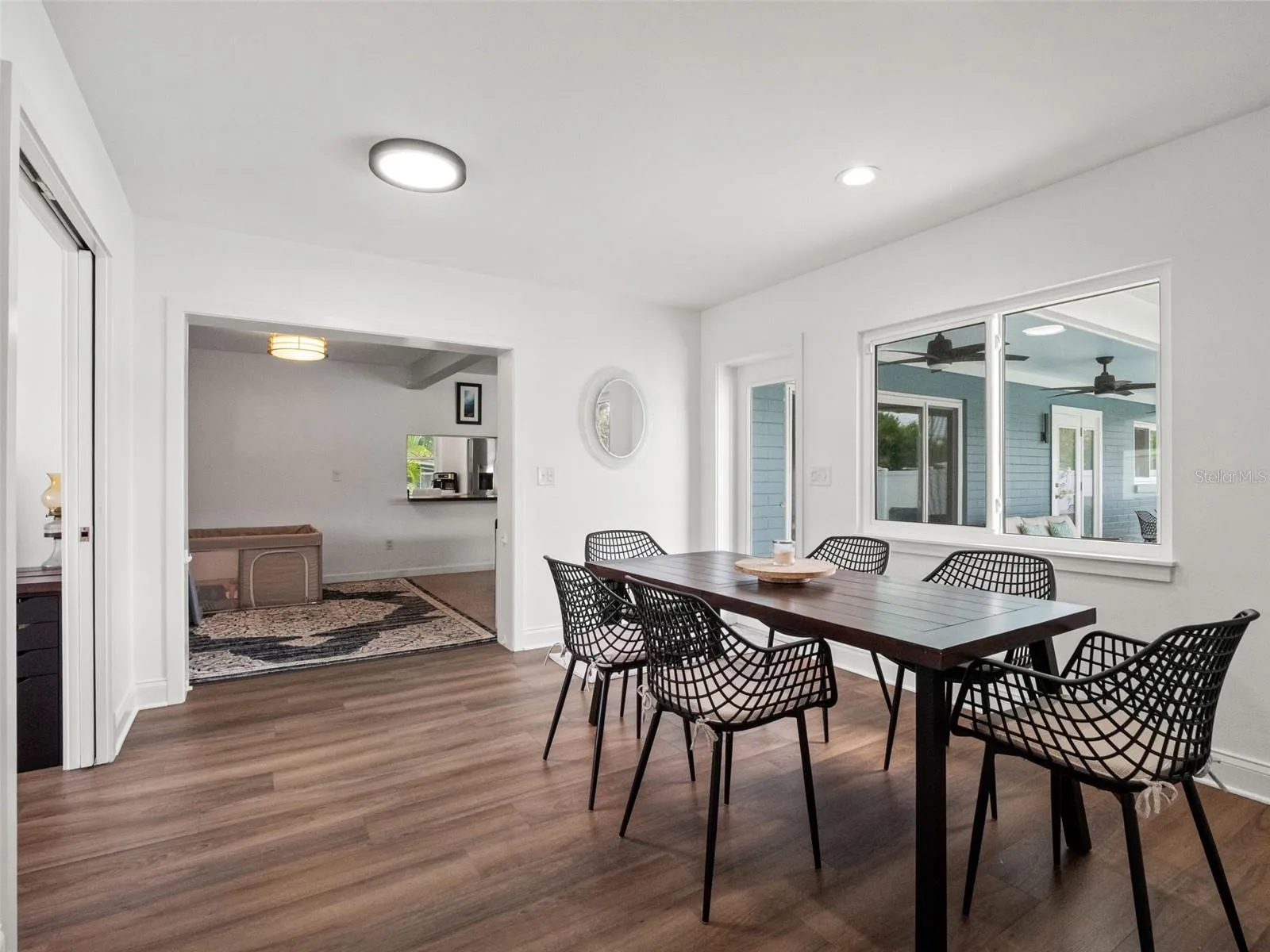 Addition with dining area, door to patio/pool, office