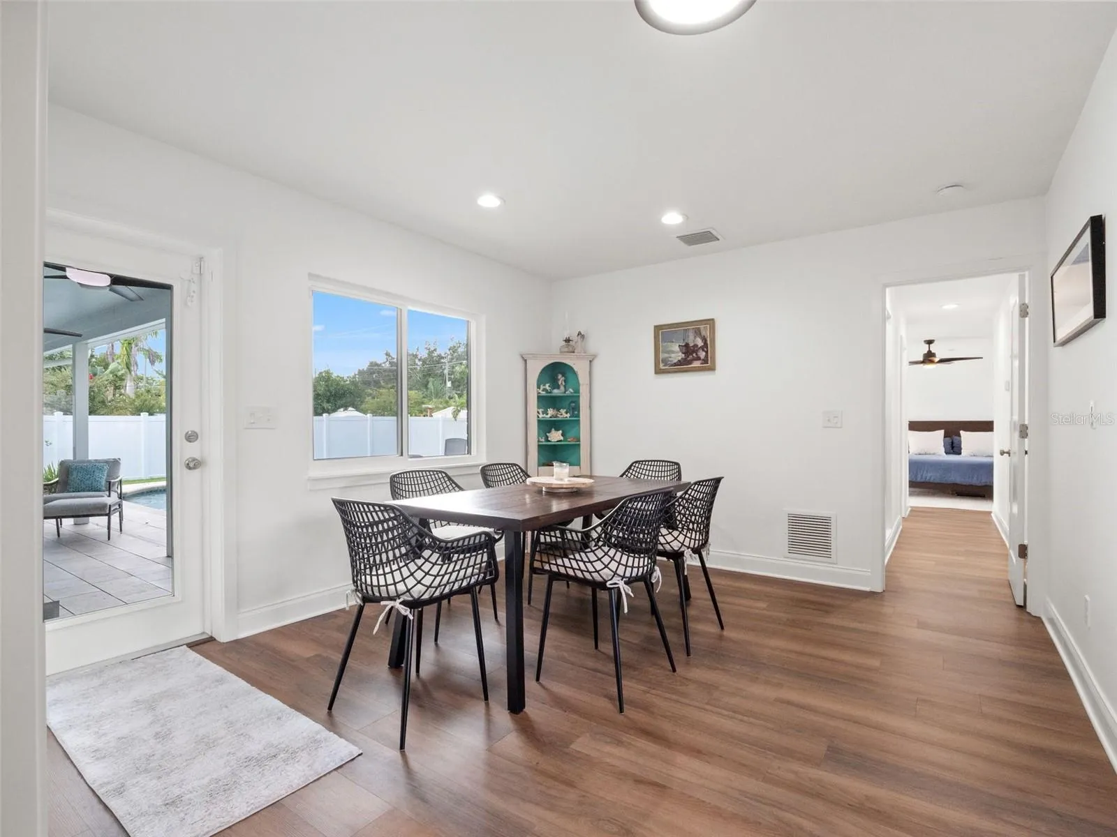 Addition with dining area, door to patio/pool, office