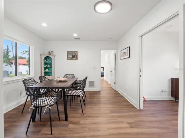 Addition with dining area, door to patio/pool, office