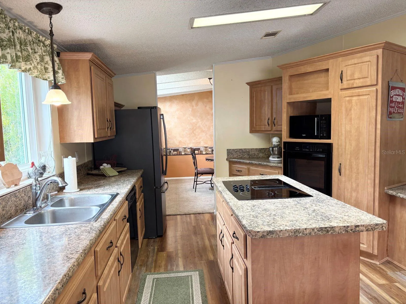 Kitchen with wall oven and cook top