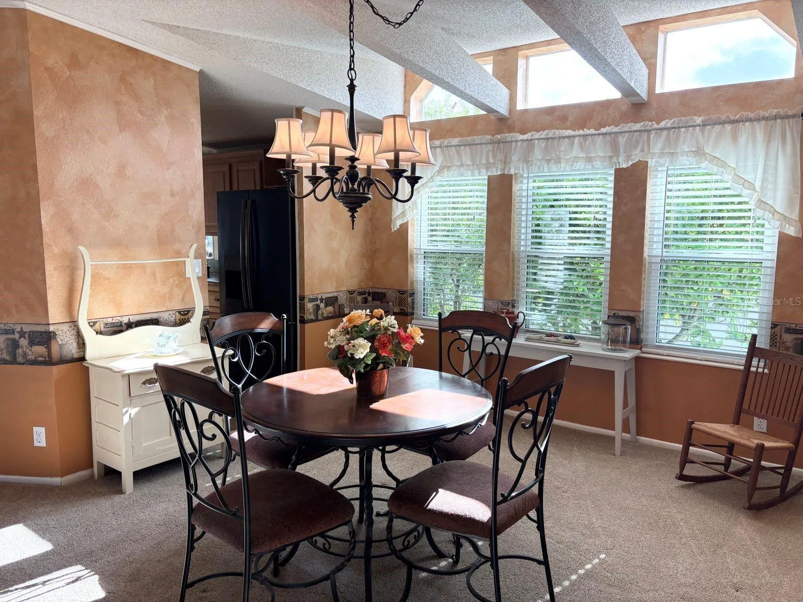 Dining room with access to kitchen and open to living room
