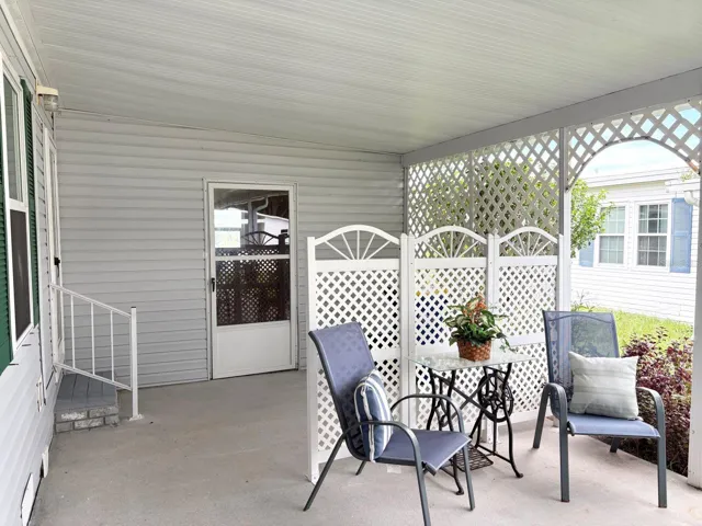 Covered carport and patio with storage shed