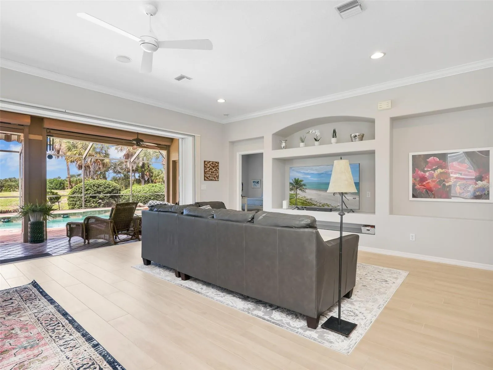 Large sliders bring in natural light and connect the home to the outdoor living space.