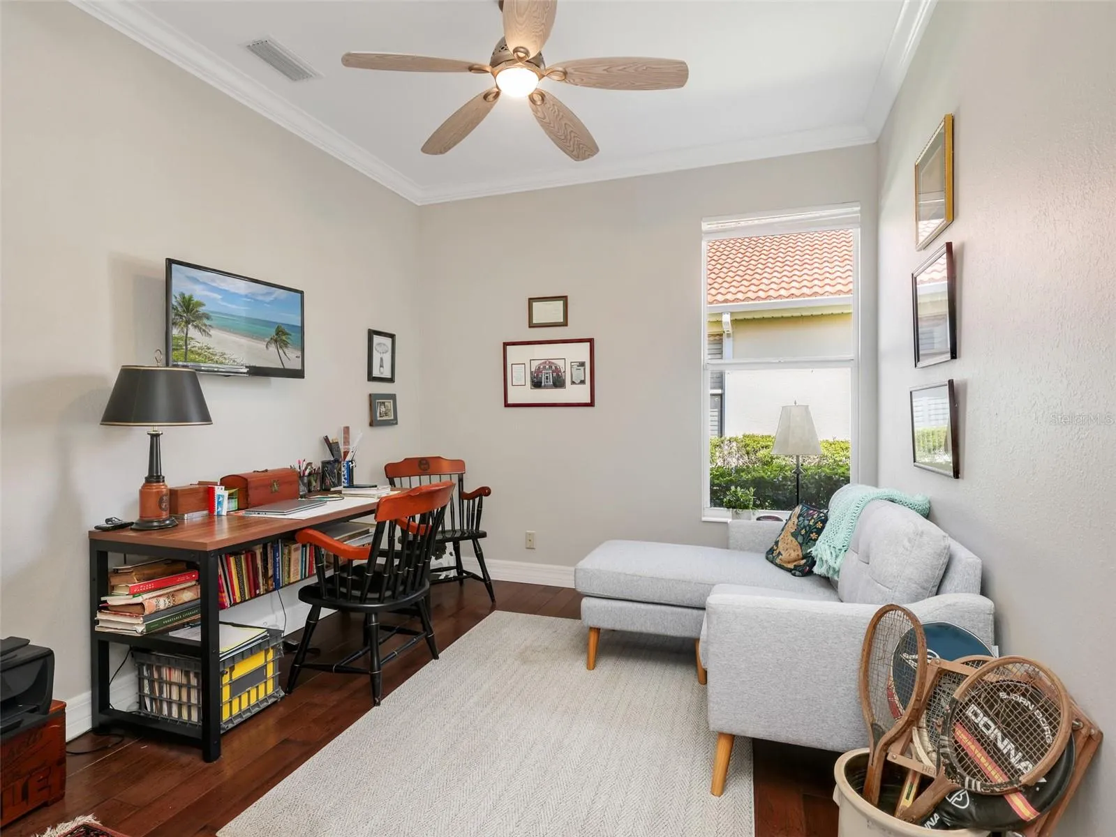 Flexible third bedroom currently used as an office and sitting area.