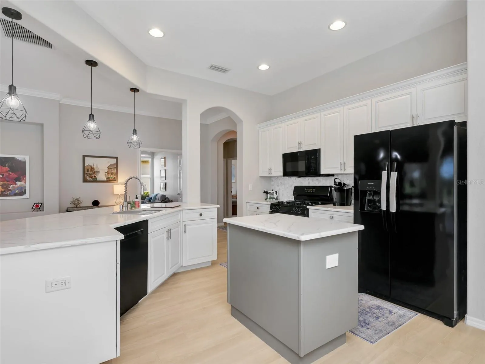 Plenty of cabinetry and workspace with an open connection to the living area.