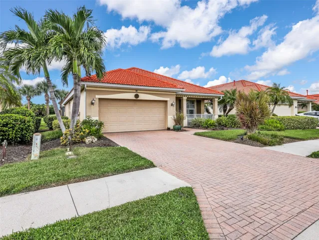 Beautifully maintained exterior surrounded by established landscaping.