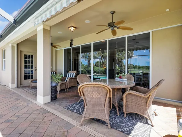 Covered lanai with electric storm shutters for added protection and convenience