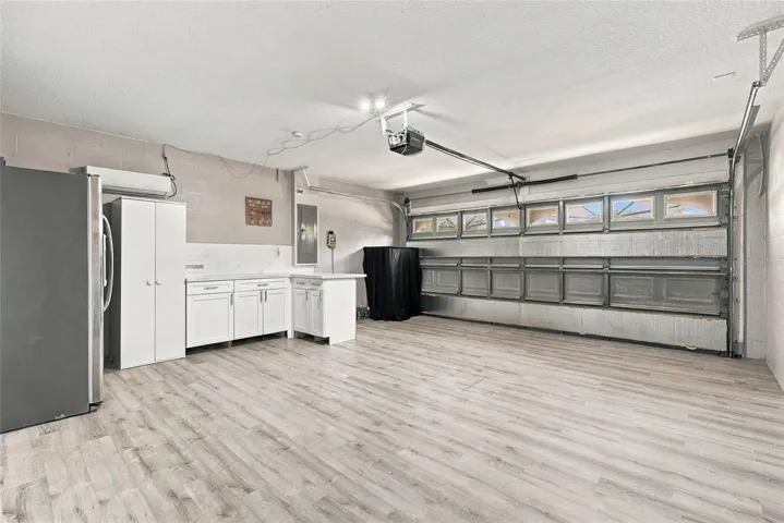Extra cabinets and a fridge in the garage that is air conditioned. This can all be removed for a true 2 car garage.