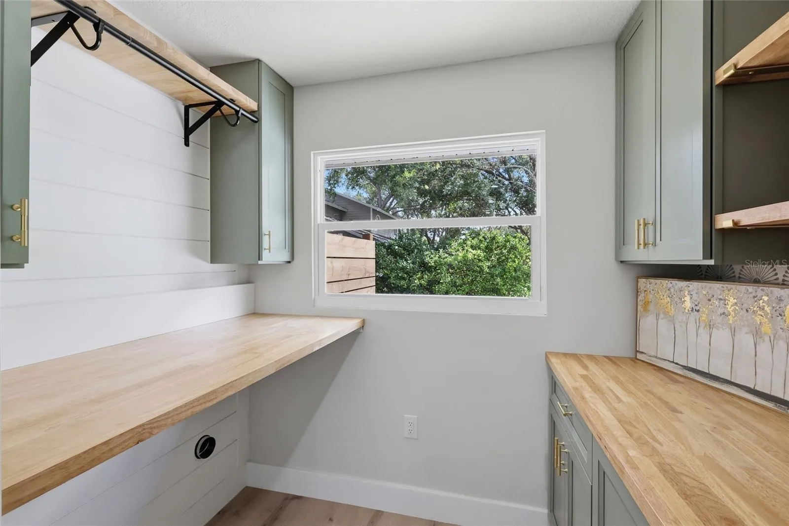 Gorgeous utility room with cabinetry, storage and sink