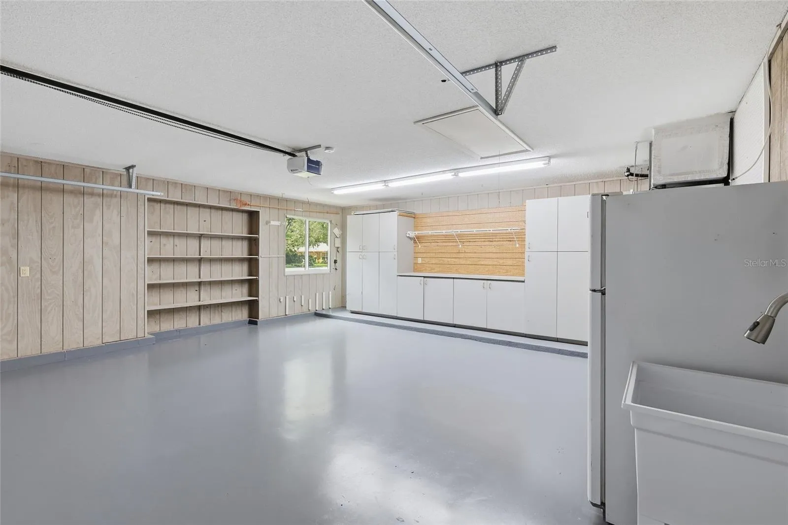 Oversized Garage with built in shelving/workshop space