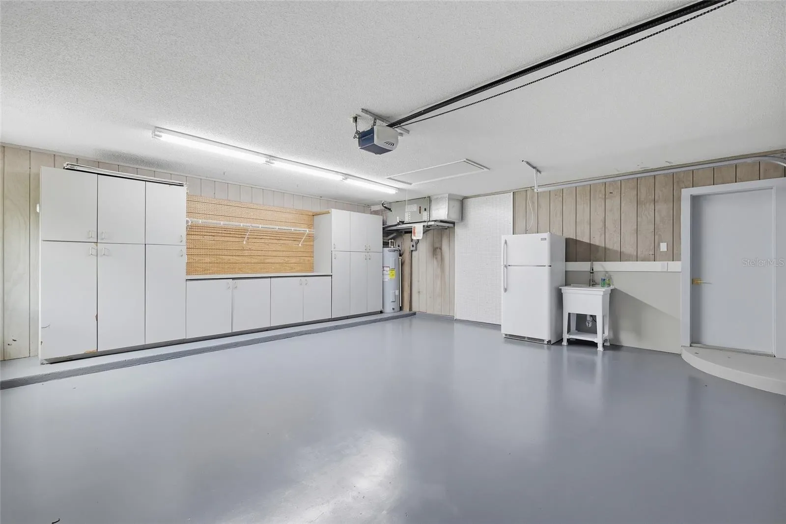 Oversized Garage with built in shelving/workshop