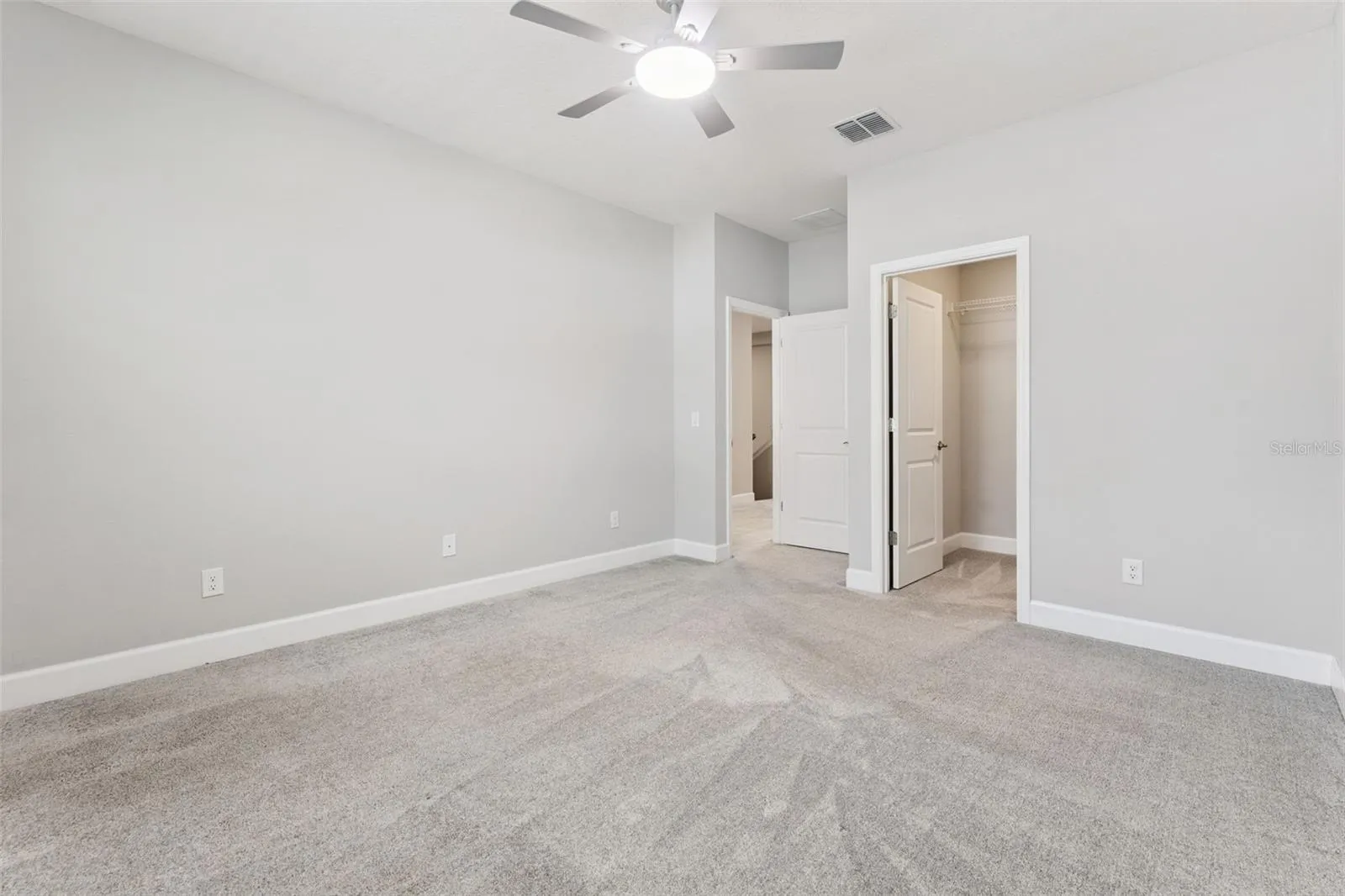 Bedroom 3 with view of walk-in closet