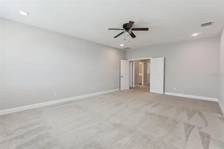 Primary Bedroom with view of bedroom 2 and bathroom 2