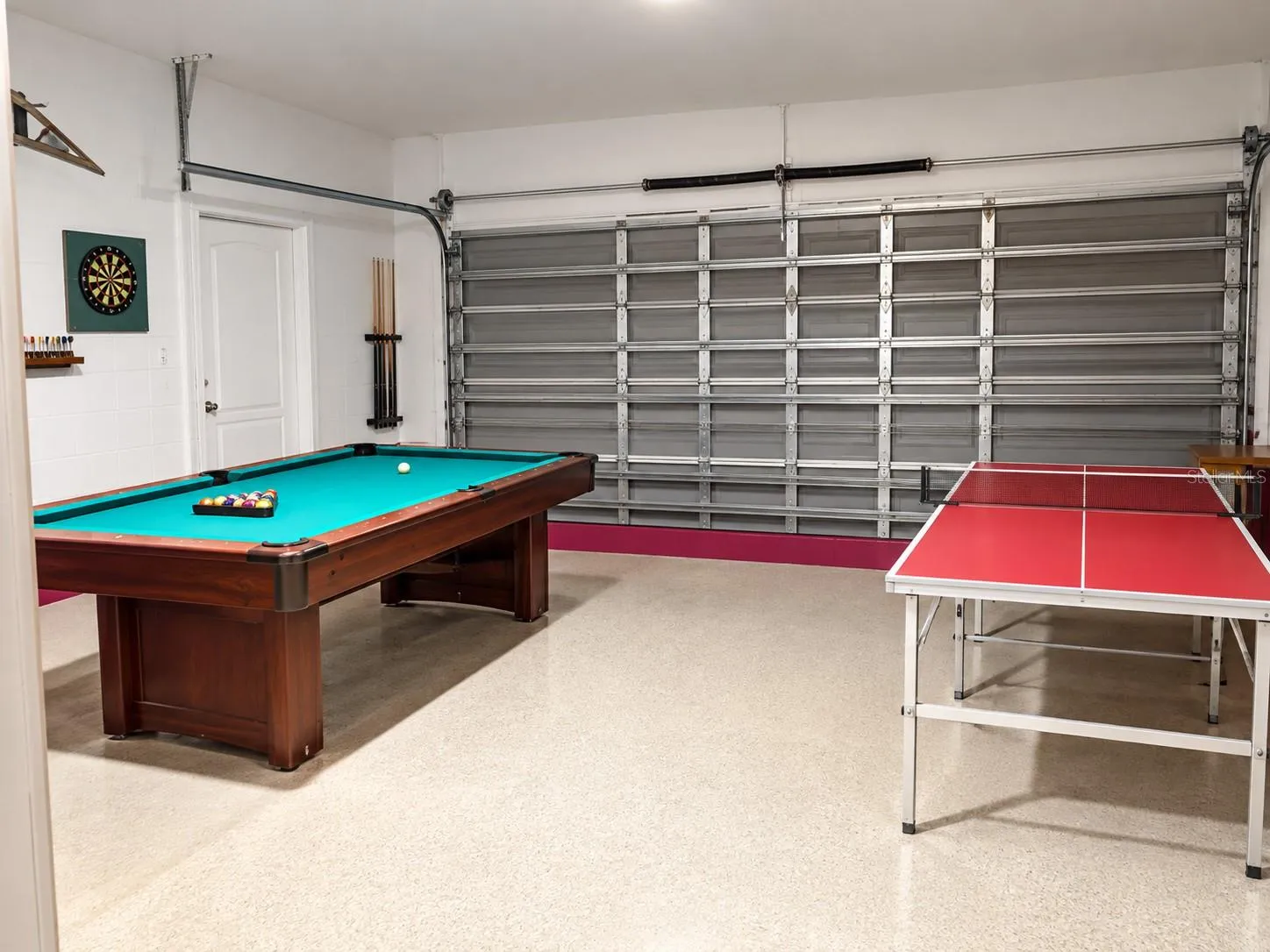 Garage w/game tables that conveys