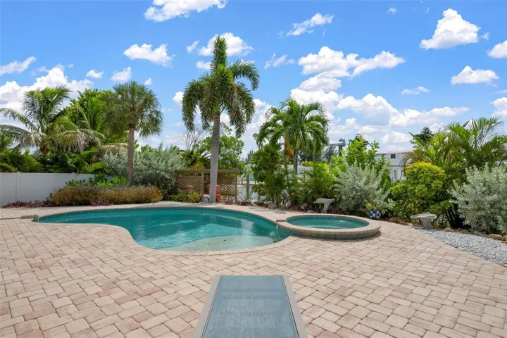 Heated saltwater pool and spa with pavered deck and southern exposure.