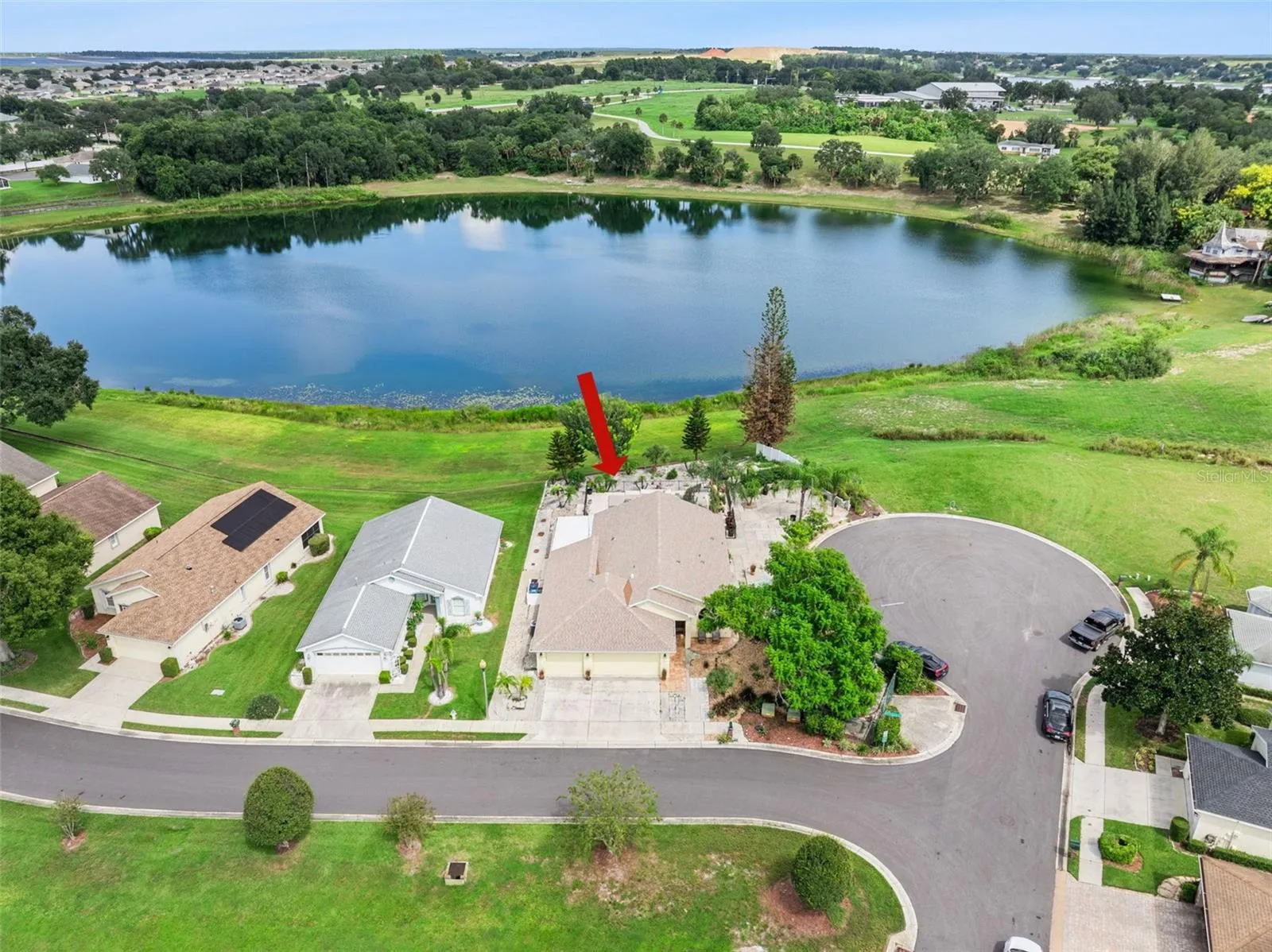 The $210 monthly HOA fee includes lawn service, private roads, and clubhouse amenities
