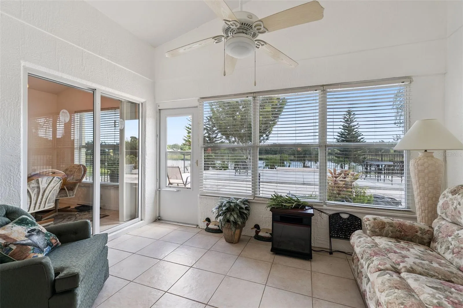 Outdoor living is truly exceptional, with two Florida Rooms and this one is heated &amp; cooled