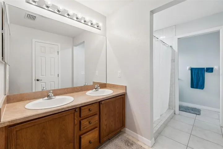 Primary Bath with Dual Sinks, Linen Closet and Water Closet with Comfort Height Toilet