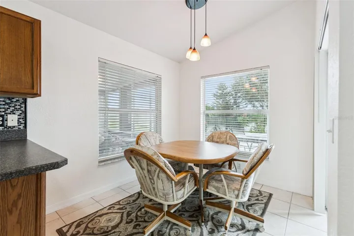 The charming breakfast nook is the perfect place to enjoy casual meals while taking in the gorgeous lake views