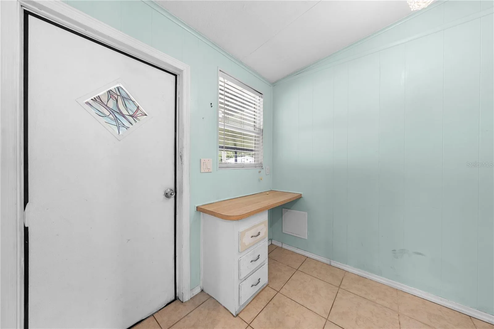 Laundry room with carport entrance door